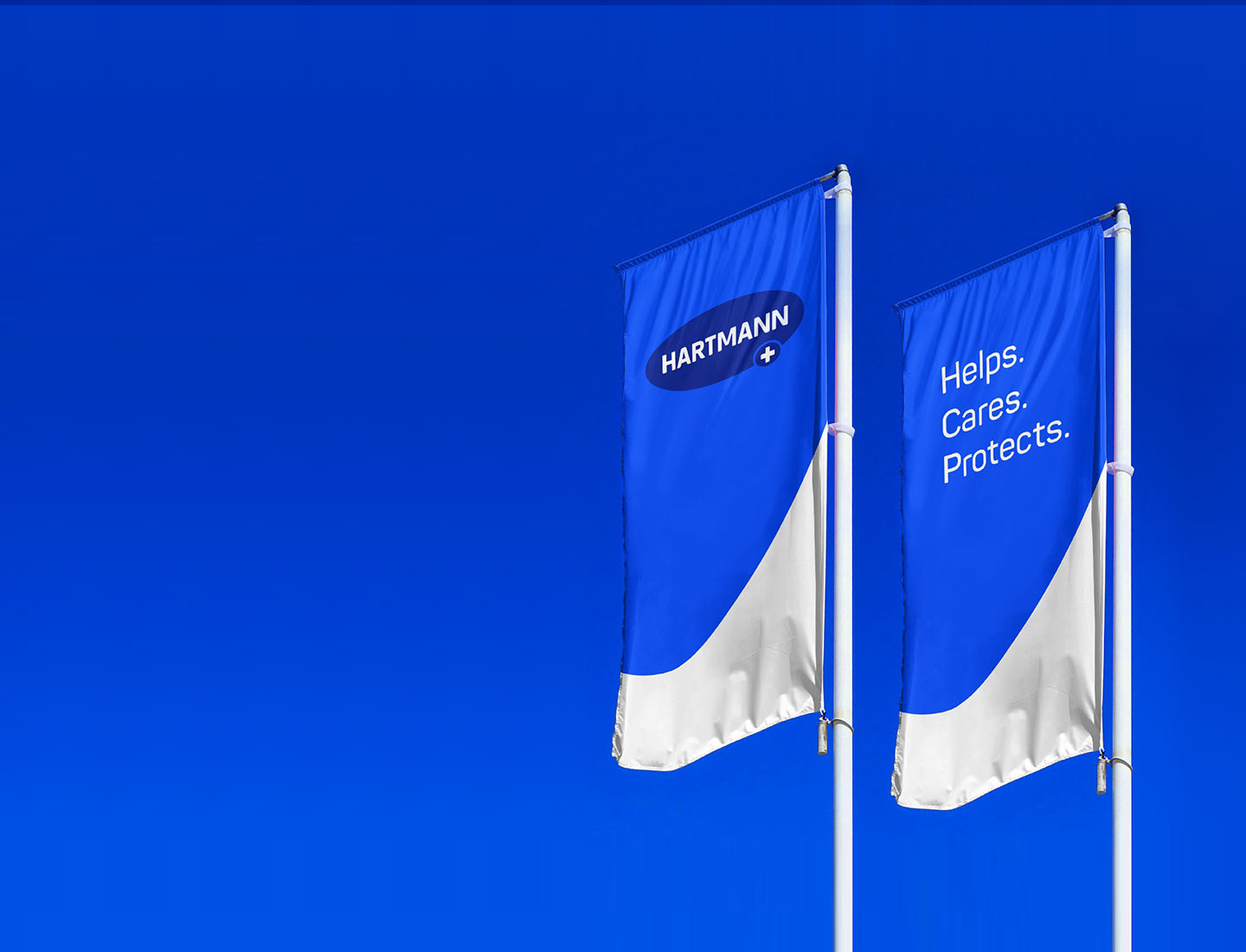 Two blue flags with HARTMANN lettering and the HARTMANN slogan "Helps. Cares. Protects."
