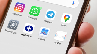 A smartphone screen showing the icon of the HARTMANN app next to other apps