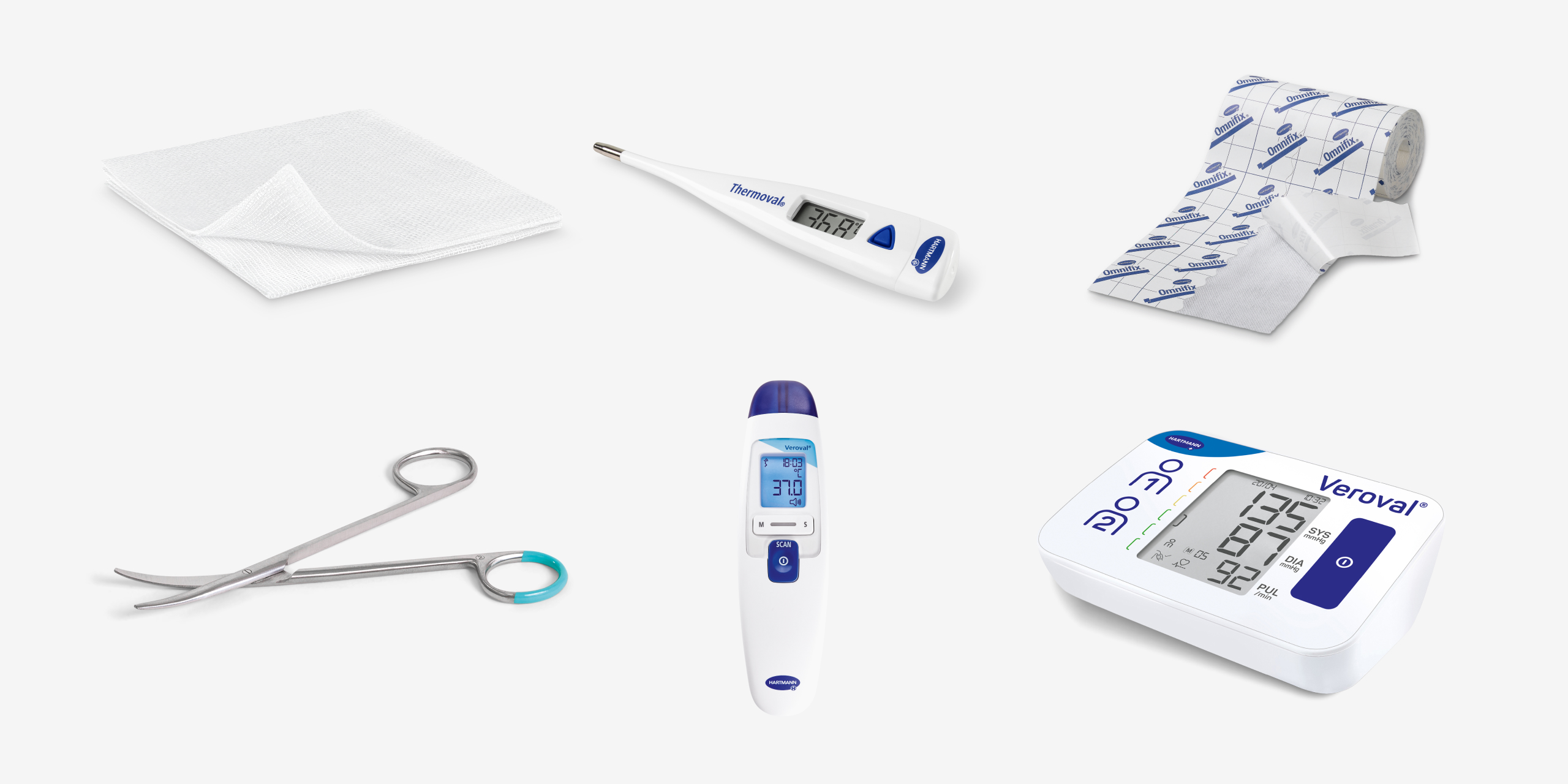 Medical supplies, including gauze pads, a digital thermometer, a bandage roll, surgical scissors, an infrared thermometer, and a blood pressure monitor.